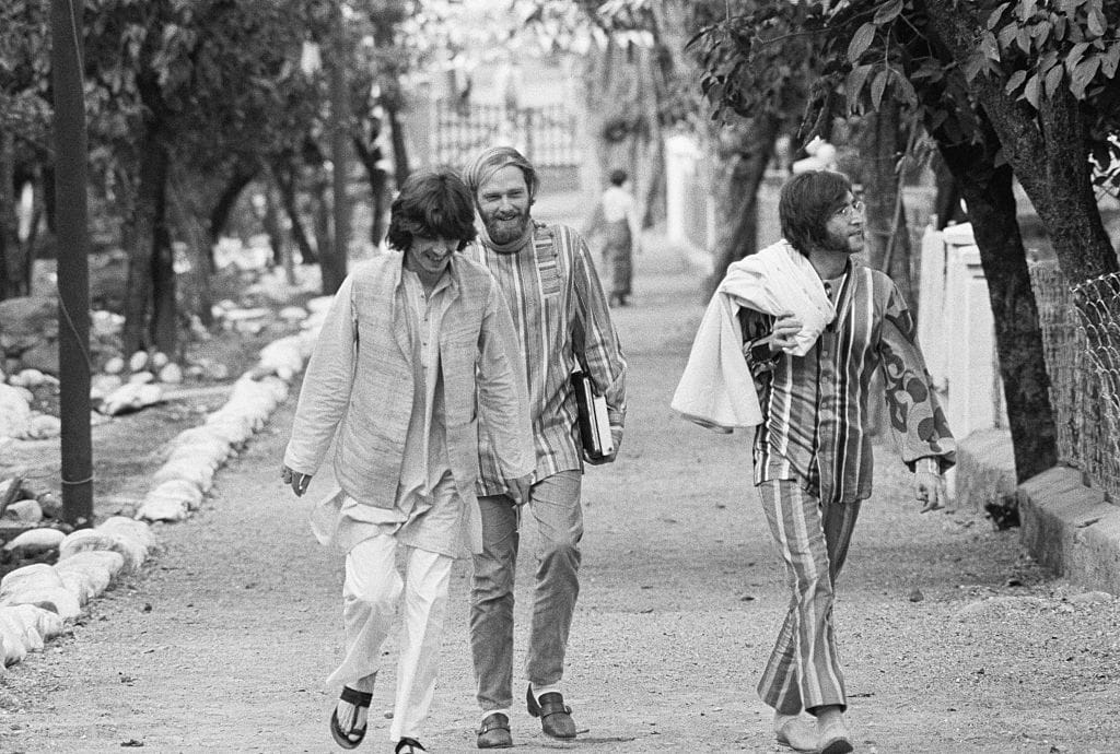 George Harrison, Mike Love, and John Lennon at the ashram near Rishikesh, India. (1968)